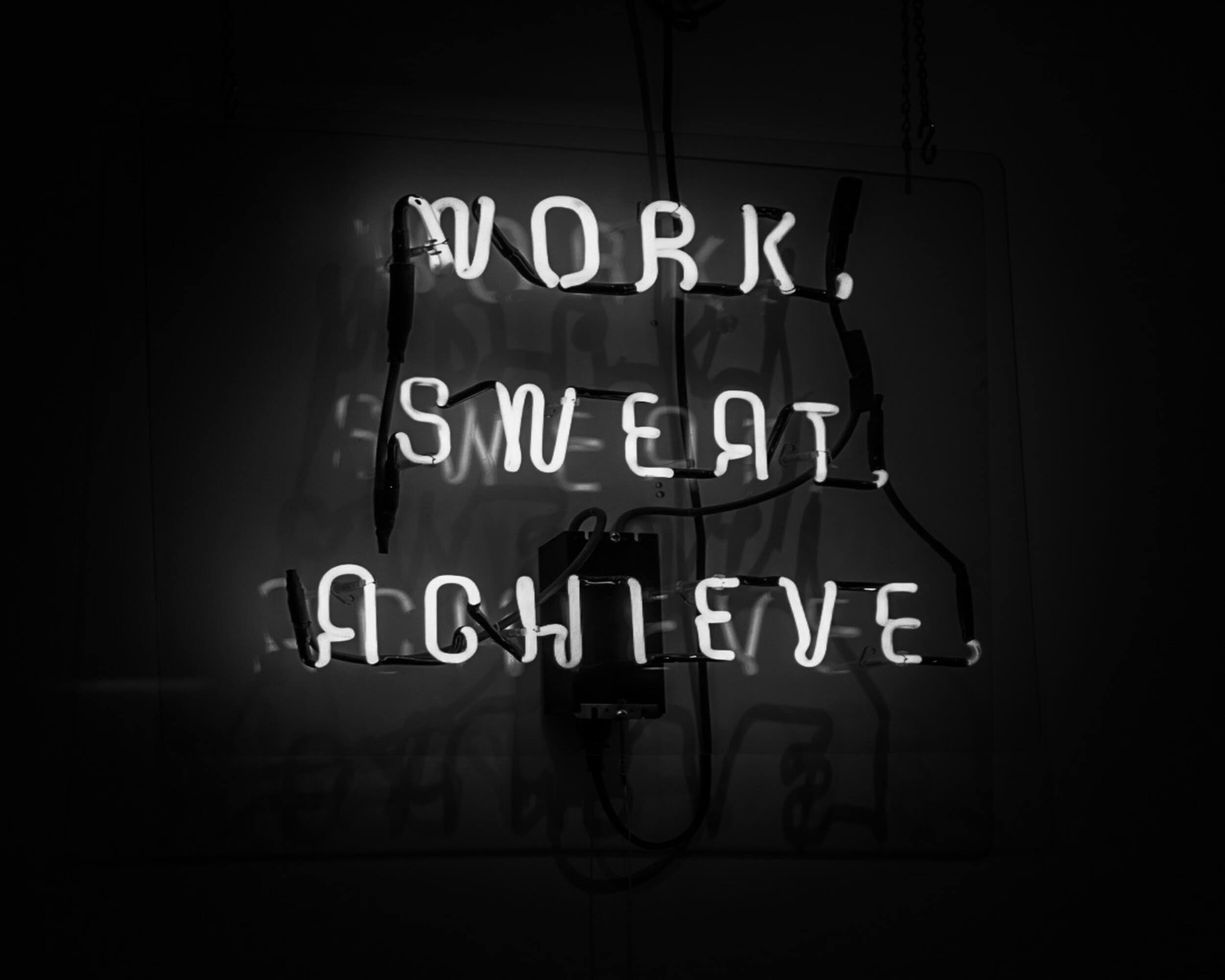 Signs of workaholism including overworking and burnout symptoms