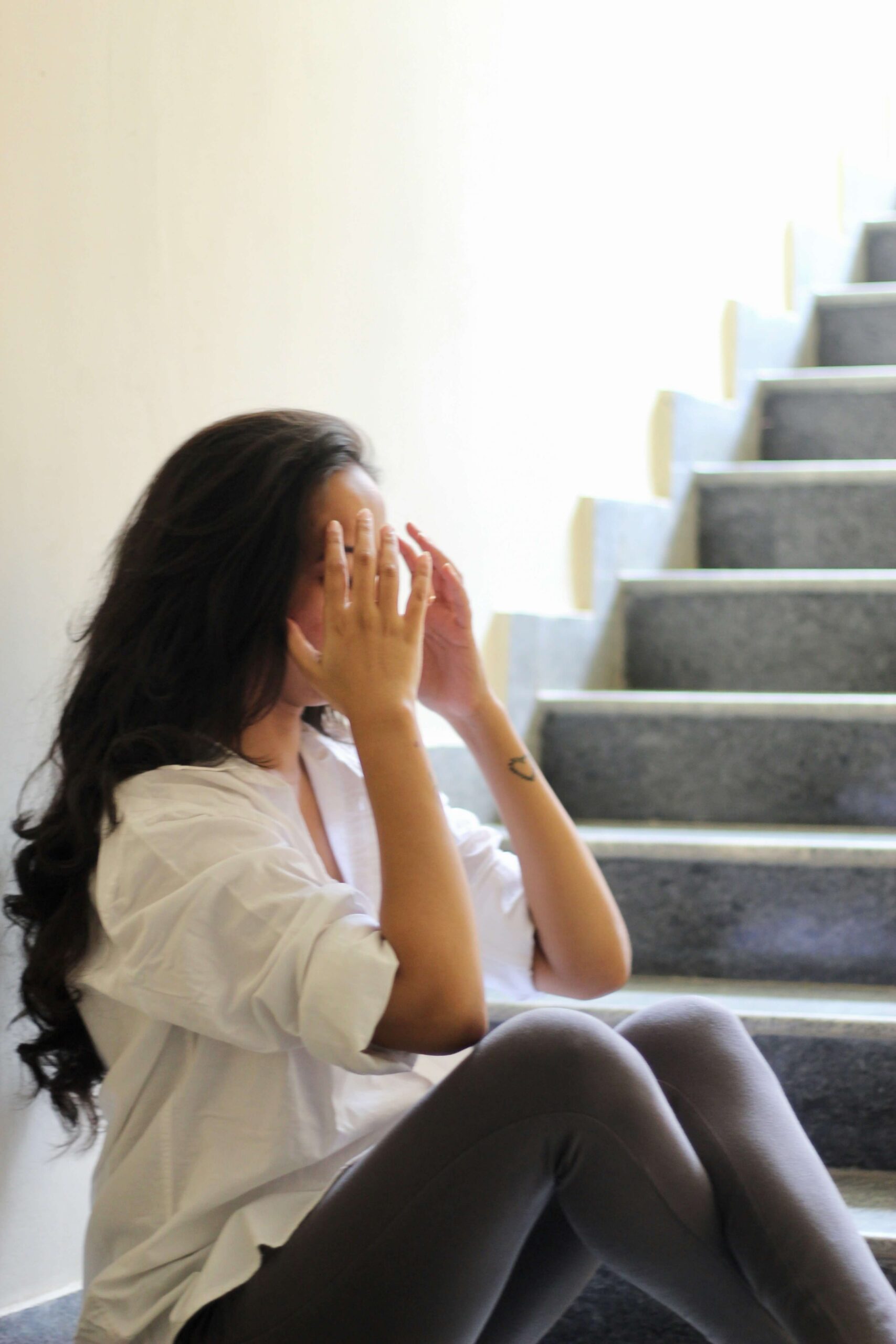 Woman sitting and looking tired during the workday